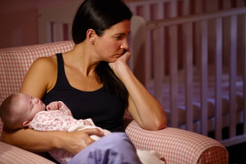 A mother's moment of joy, overshadowed by national tragedy. (Image Credit: Think Stock)