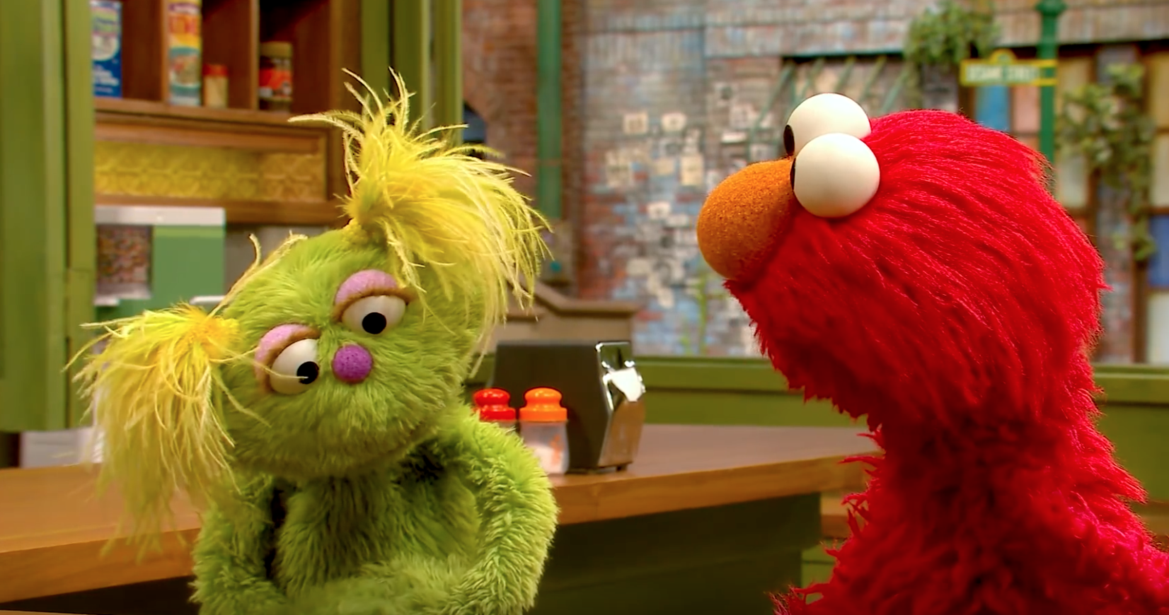 Karli and Elmo (via YouTube)