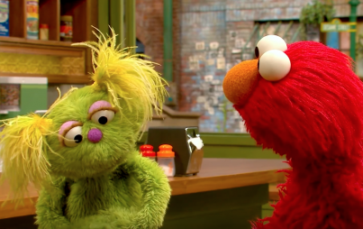 Karli and Elmo (via YouTube)